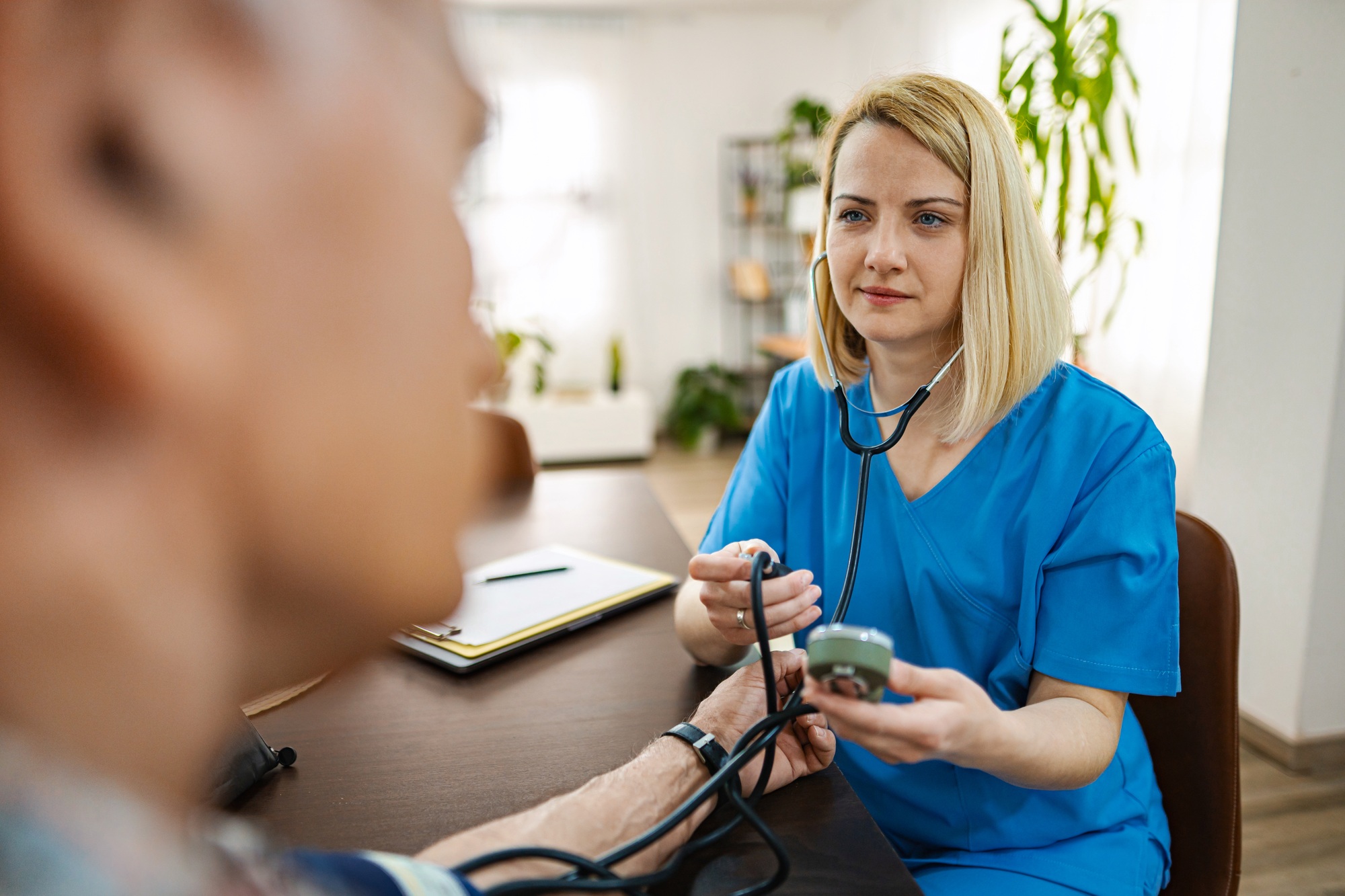 Health check performed by a nurse for an elderly patient